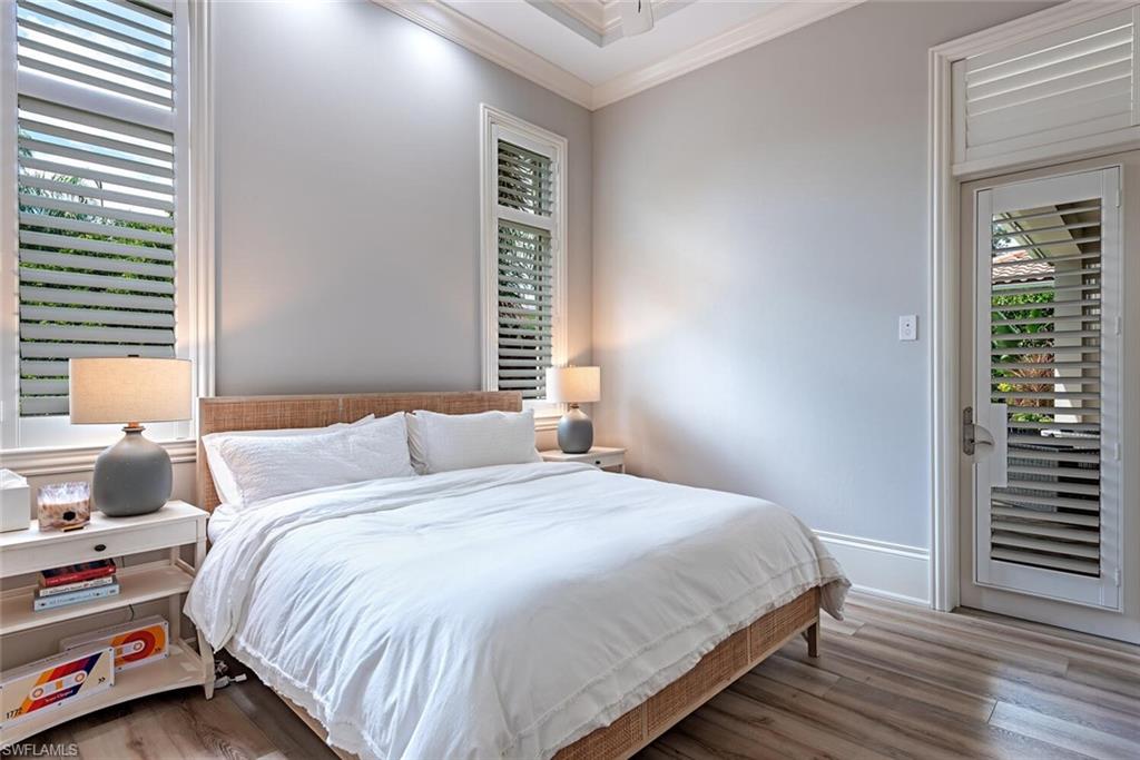 2087 Rivoli Court Naples, FL 34105 - Photo 11 of 37 a bedroom with a bed and a window