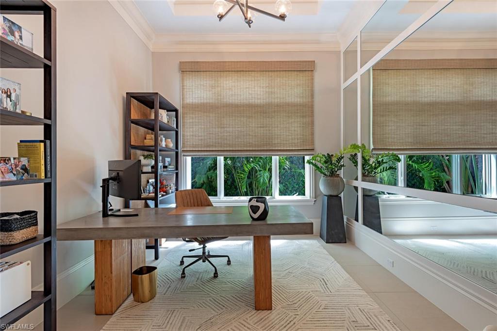 2087 Rivoli Court Naples, FL 34105 - Photo 14 of 37 a living room filled with furniture and a potted plant