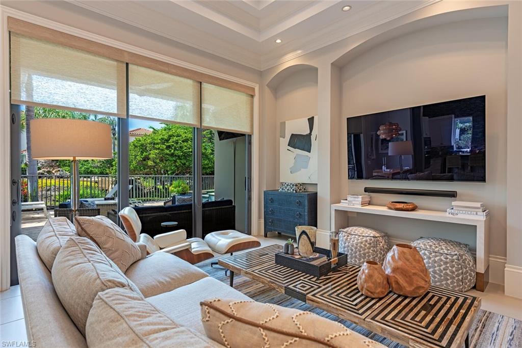 2087 Rivoli Court Naples, FL 34105 - Photo 2 of 37 a living room with furniture and a flat screen tv
