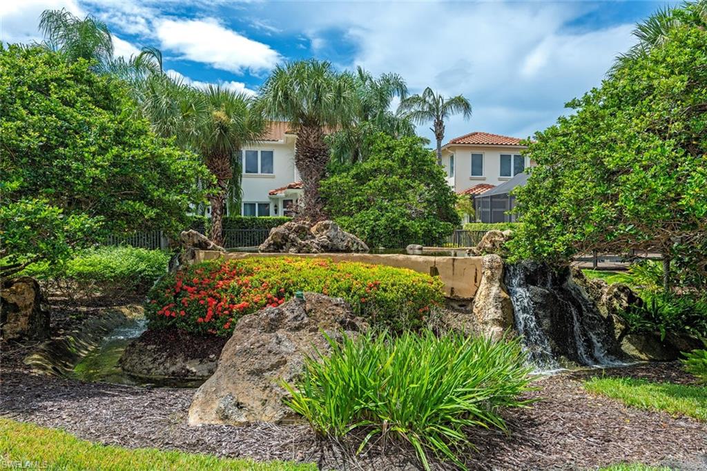 2087 Rivoli Court Naples, FL 34105 - Photo 22 of 37 a view of a house with a yard and potted plants