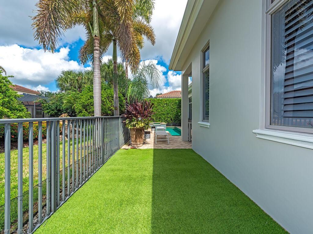 2087 Rivoli Court Naples, FL 34105 - Photo 37 of 37 a view of a porch with a backyard