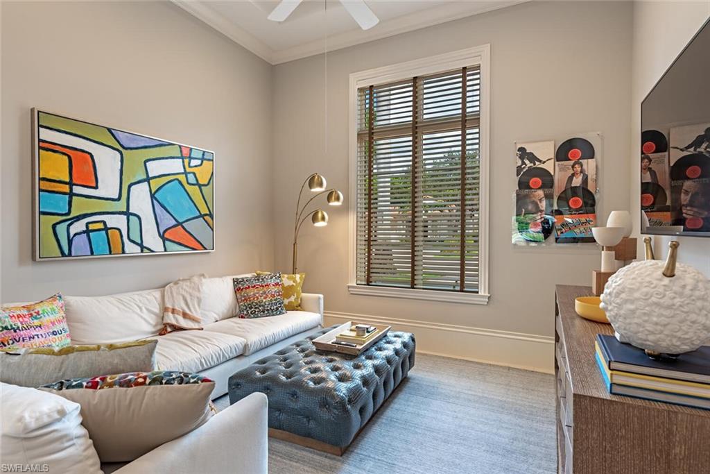 2087 Rivoli Court Naples, FL 34105 - Photo 4 of 37 a bedroom with furniture and a window