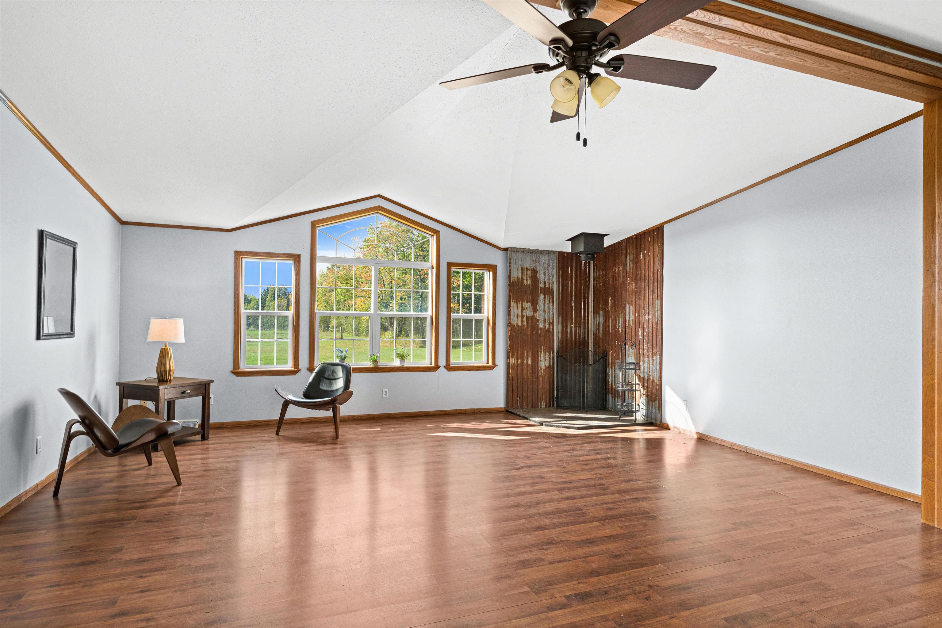 3126 Beyer Road Duluth, MN 55804 - Photo 10 of 22 Living room w vaulted ceiling & southern facing windows taking in sunshine & view of yard & field.