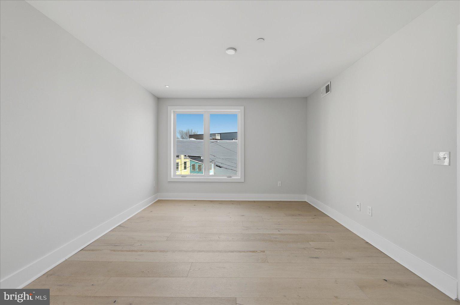 919 12th Street Northeast, Unit 303 Washington, DC 20002 - Photo 12 of 22 a view of an empty room with a window