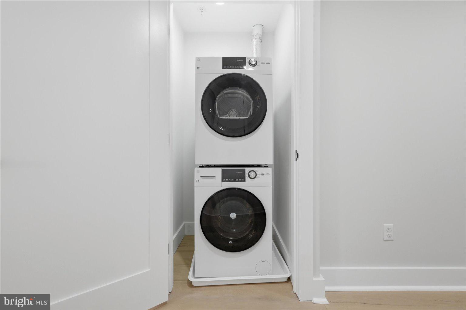 919 12th Street Northeast, Unit 303 Washington, DC 20002 - Photo 15 of 22 a view of a hallway with washer and dryer