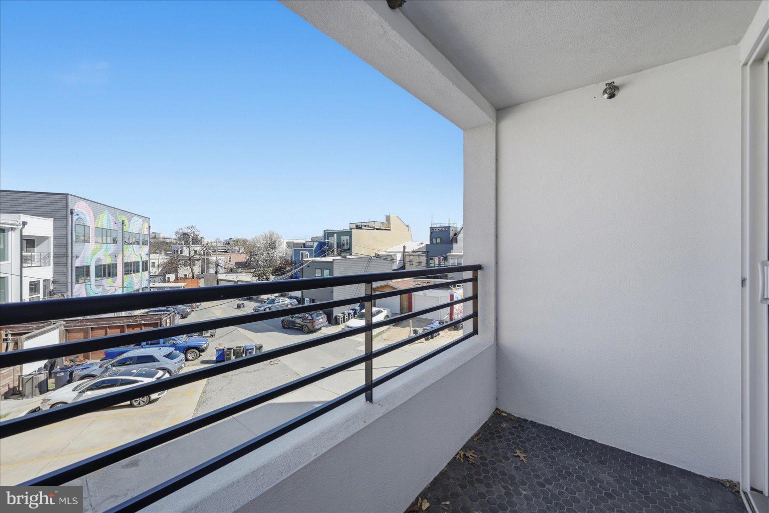 919 12th Street Northeast, Unit 303 Washington, DC 20002 - Photo 16 of 22 a view of a balcony with wooden floor