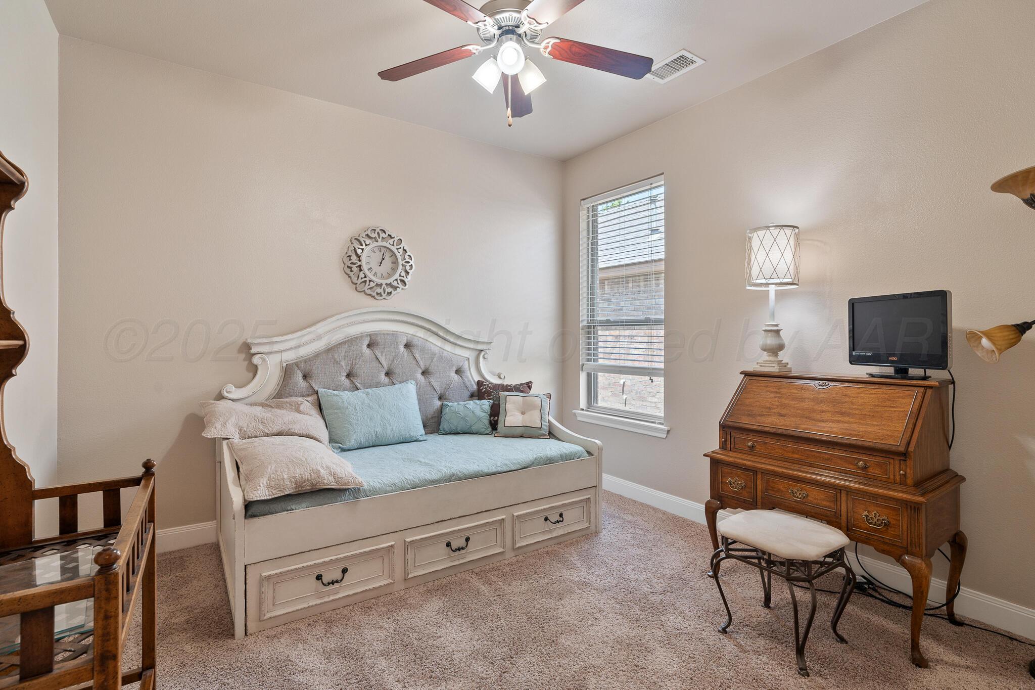 7116 Sinclair Street Amarillo, TX 79119 - Photo 16 of 23 a bedroom with furniture and a window