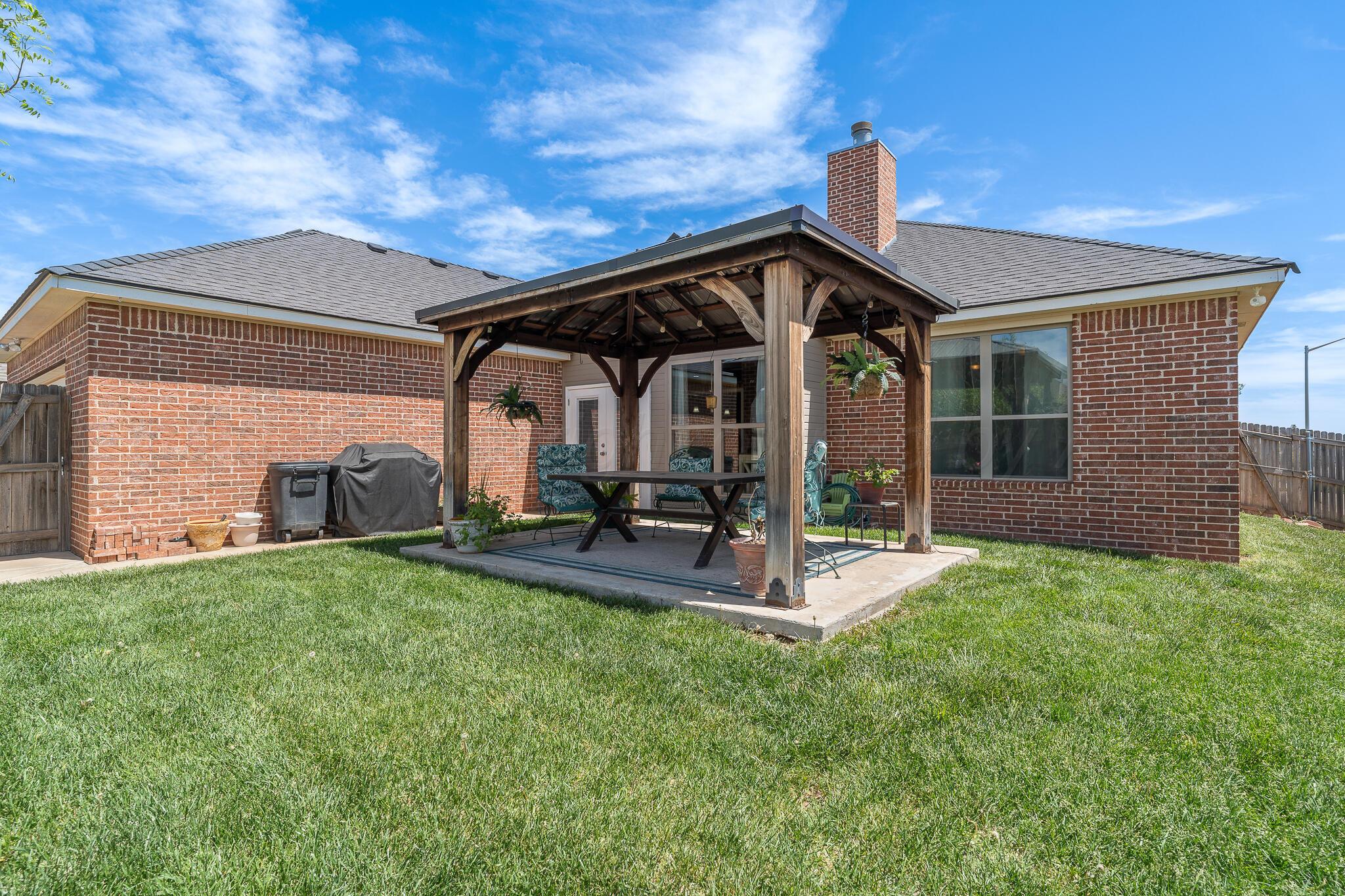 7116 Sinclair Street Amarillo, TX 79119 - Photo 20 of 23 a house view with a garden space