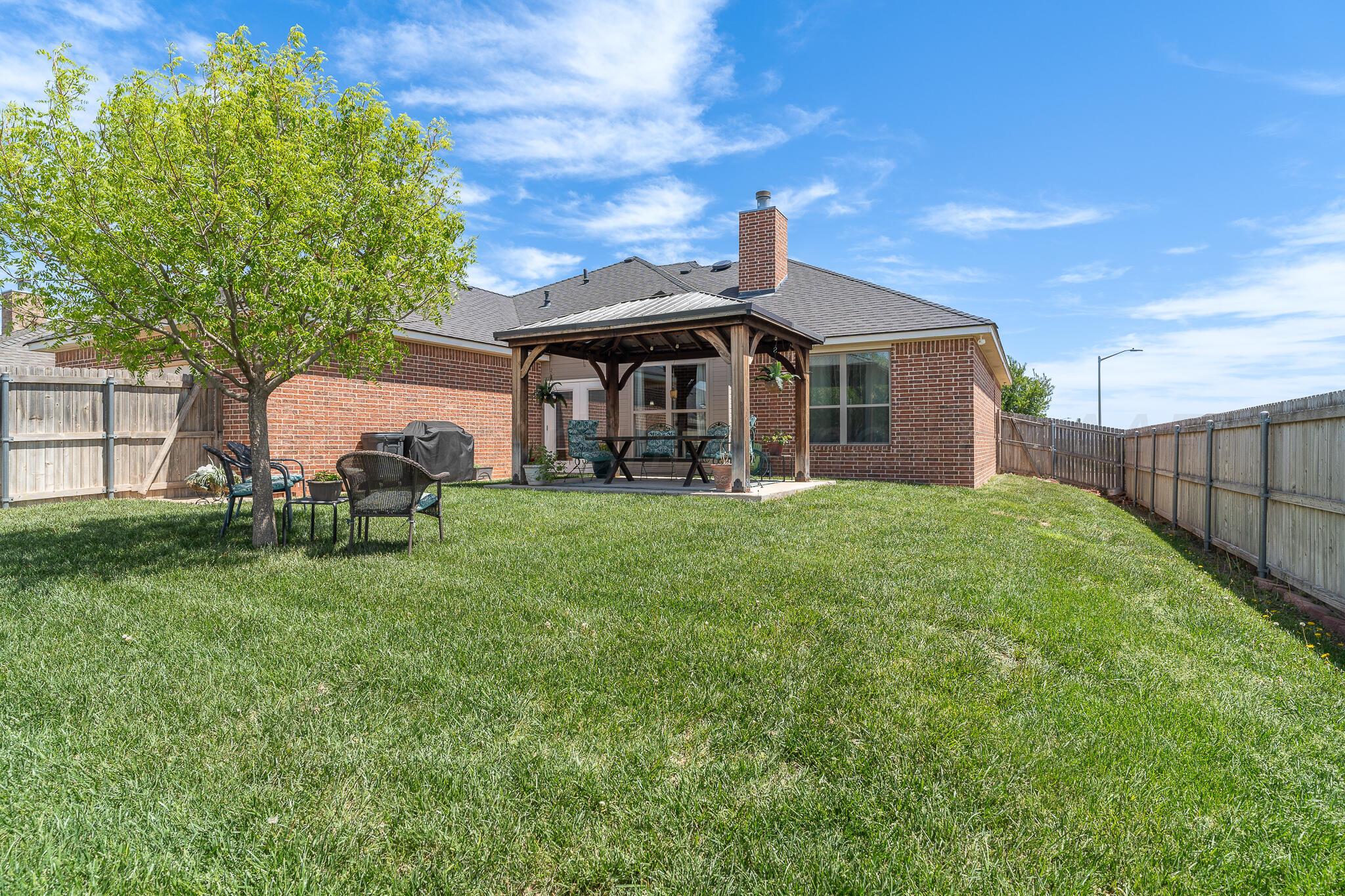 7116 Sinclair Street Amarillo, TX 79119 - Photo 21 of 23 a front view of a house with garden