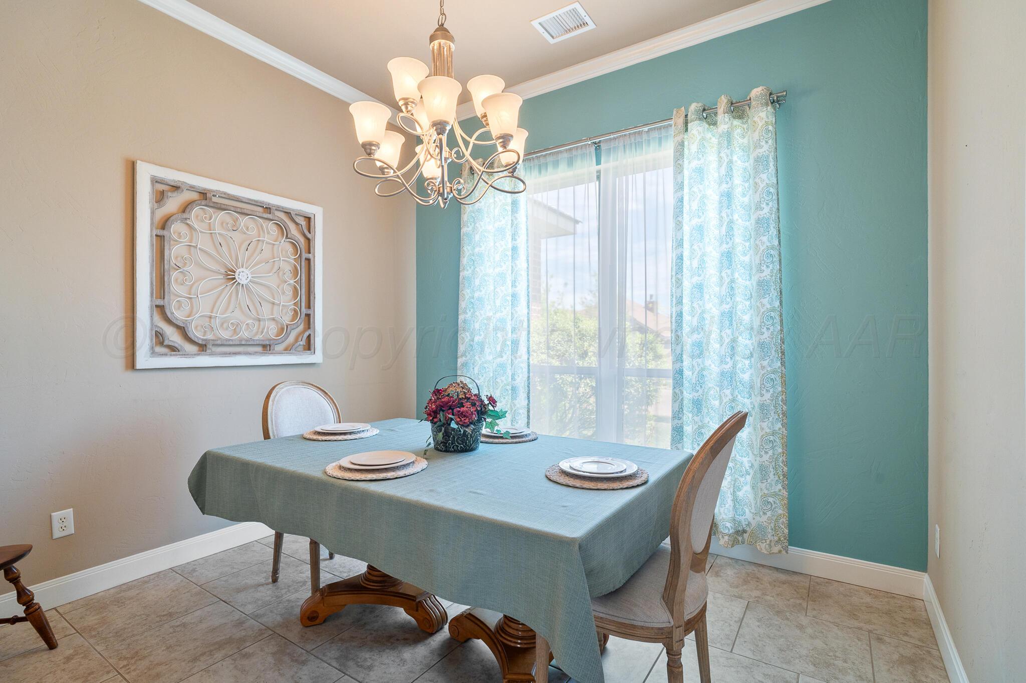 7116 Sinclair Street Amarillo, TX 79119 - Photo 8 of 23 a view of a dining room with furniture window and outside view