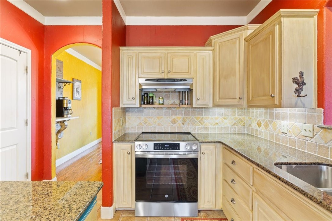 551 Bottoms East Road Temple, TX 76501 - Photo 12 of 44 a kitchen with stainless steel appliances a stove and a sink