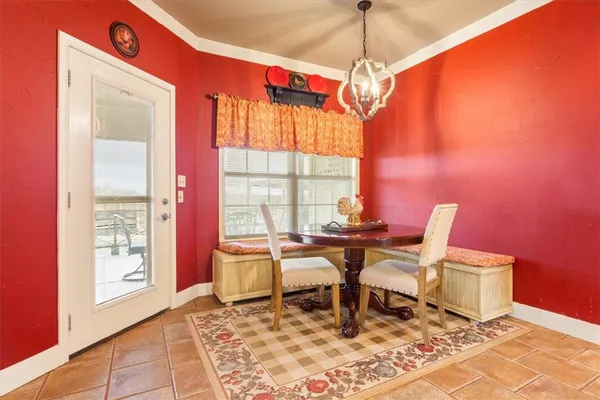 a work room with furniture and a window