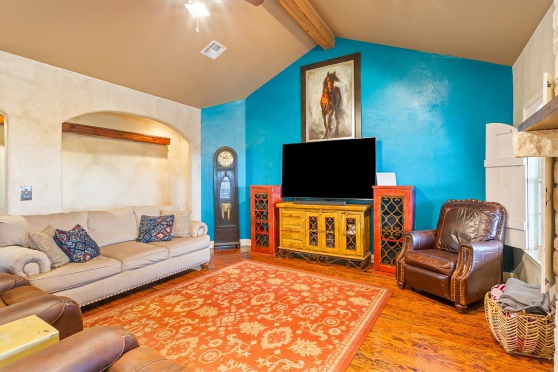 551 Bottoms East Road Temple, TX 76501 - Photo 18 of 44 a living room with furniture and a flat screen tv