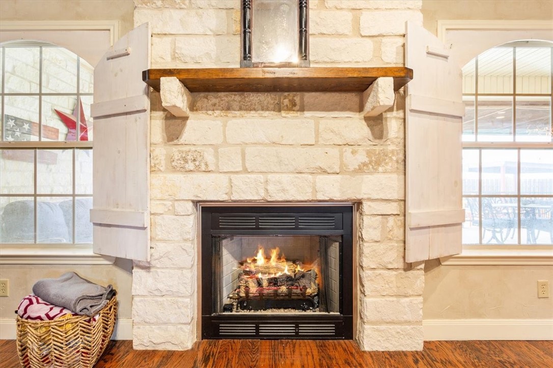 551 Bottoms East Road Temple, TX 76501 - Photo 19 of 44 a living room with a fireplace and a large window