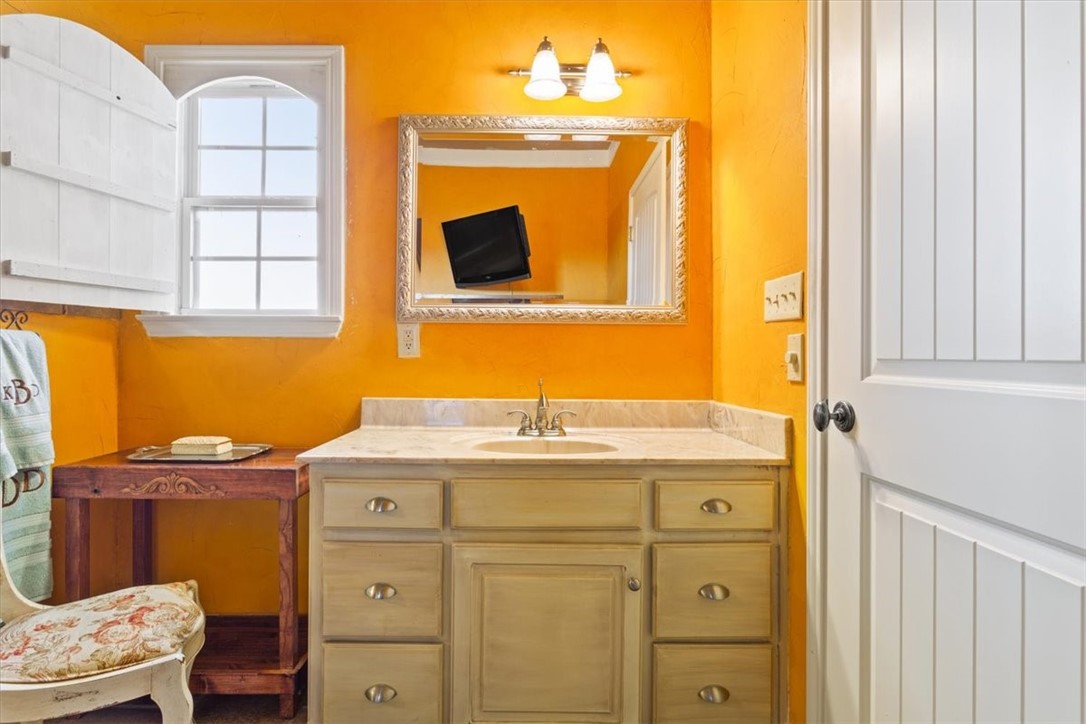 551 Bottoms East Road Temple, TX 76501 - Photo 25 of 44 a bathroom with a sink a mirror and a toilet
