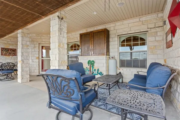 a view of living room filled with furniture