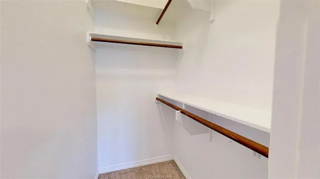 a view of staircase with white walls
