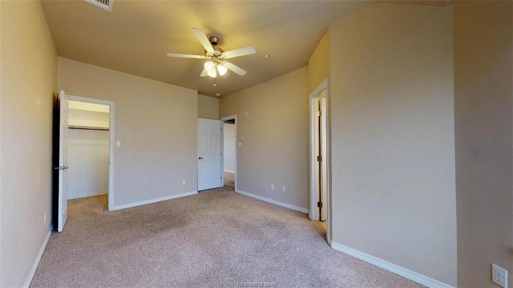 1198 Jones-Butler Road, Unit 2607 College Station, TX 77840 - Photo 16 of 20 a view of an empty room and chandelier fan