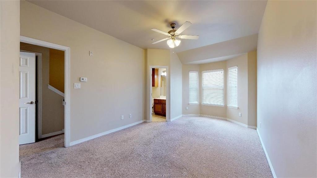 1198 Jones-Butler Road, Unit 2607 College Station, TX 77840 - Photo 17 of 20 a view of an empty room with chandelier fan