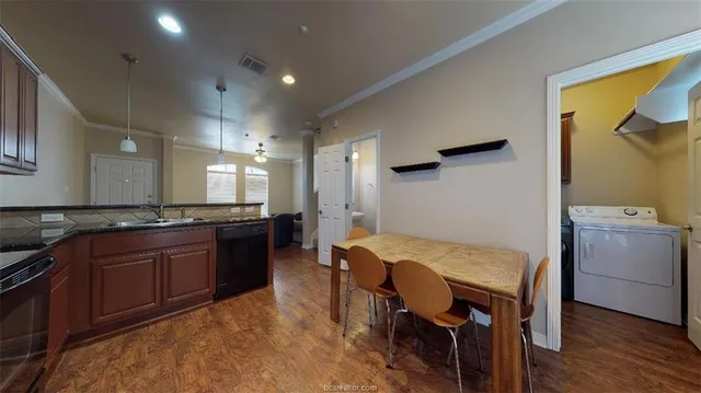 a kitchen with a table and chairs in it