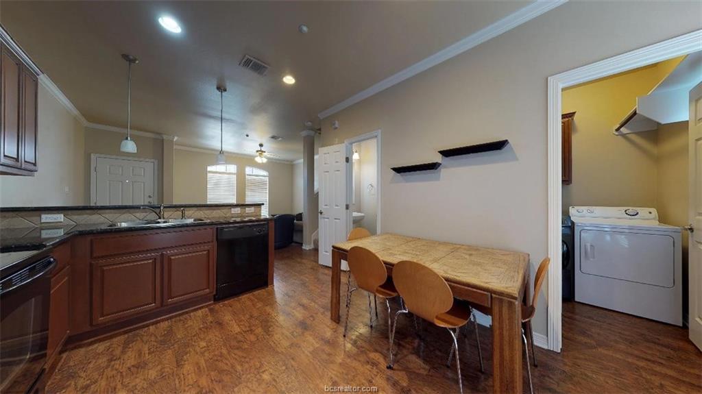 1198 Jones-Butler Road, Unit 2607 College Station, TX 77840 - Photo 8 of 20 a kitchen with a table and chairs in it