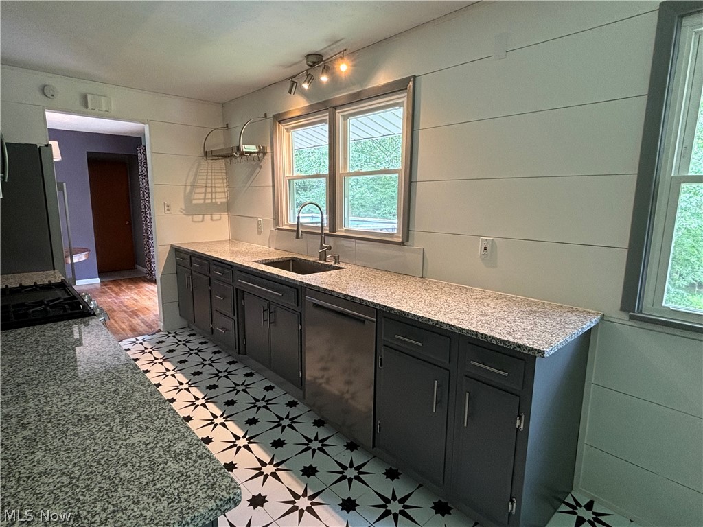 7595 Webster Road Cleveland, OH 44130 - Photo 11 of 45 Kitchen features large windows with fabulous views of the wooded yard
