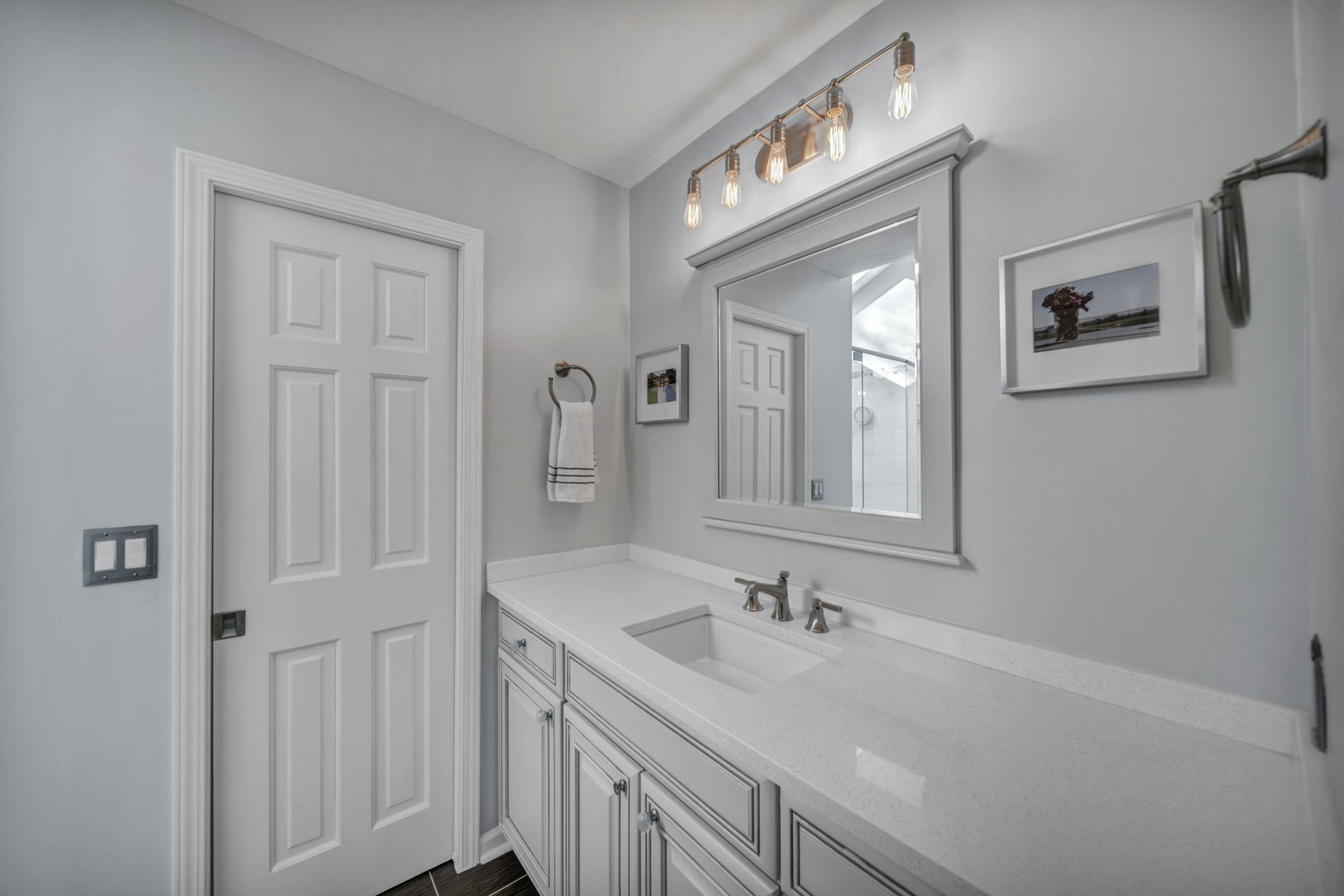 1810 Wagner Road Glenview, IL 60025 - Photo 15 of 32 a bathroom with a sink and a mirror