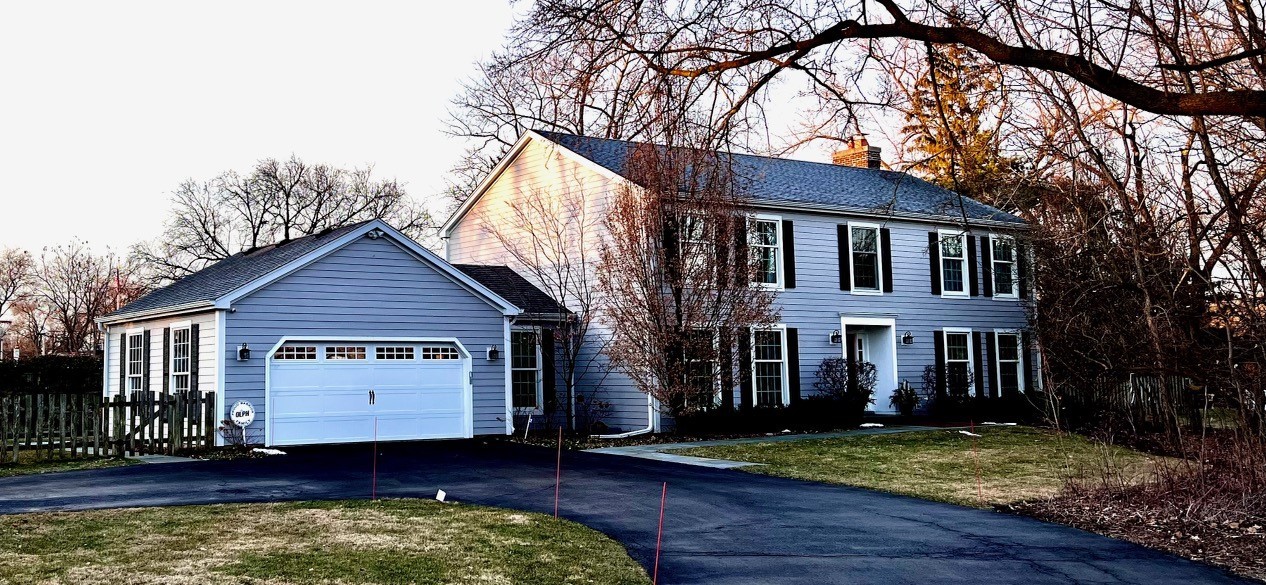 1810 Wagner Road Glenview, IL 60025 - Photo 2 of 32 a view of a house with a small yard and a large tree
