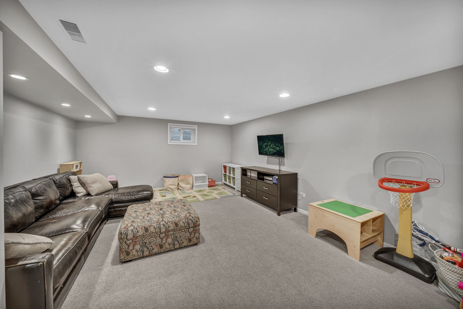 1810 Wagner Road Glenview, IL 60025 - Photo 22 of 32 a living room with furniture and a flat screen tv