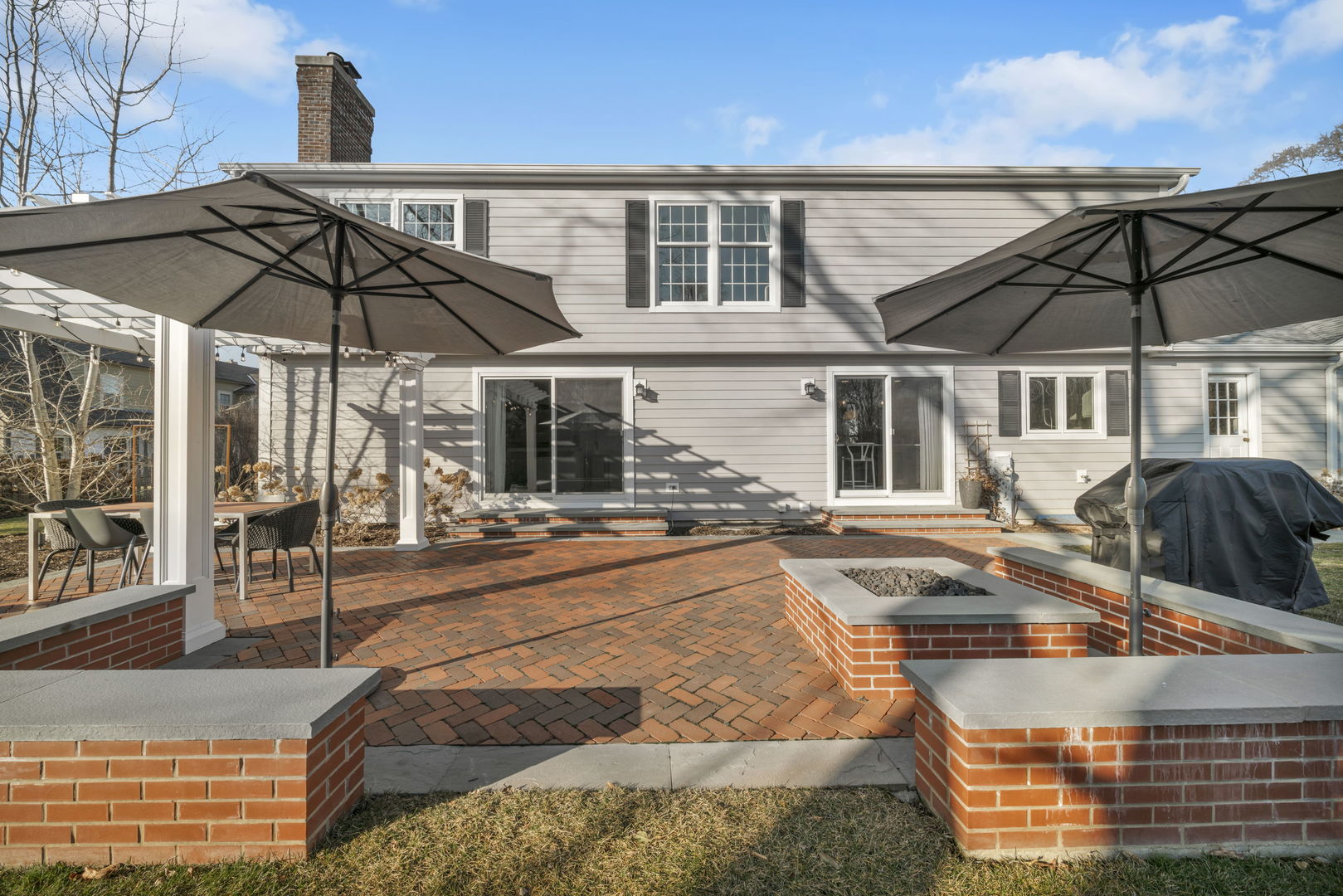 1810 Wagner Road Glenview, IL 60025 - Photo 27 of 32 a view of a patio with a table and chairs under an umbrella
