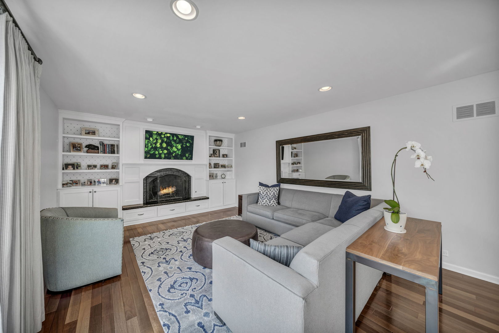 1810 Wagner Road Glenview, IL 60025 - Photo 9 of 32 a living room with furniture and a fireplace
