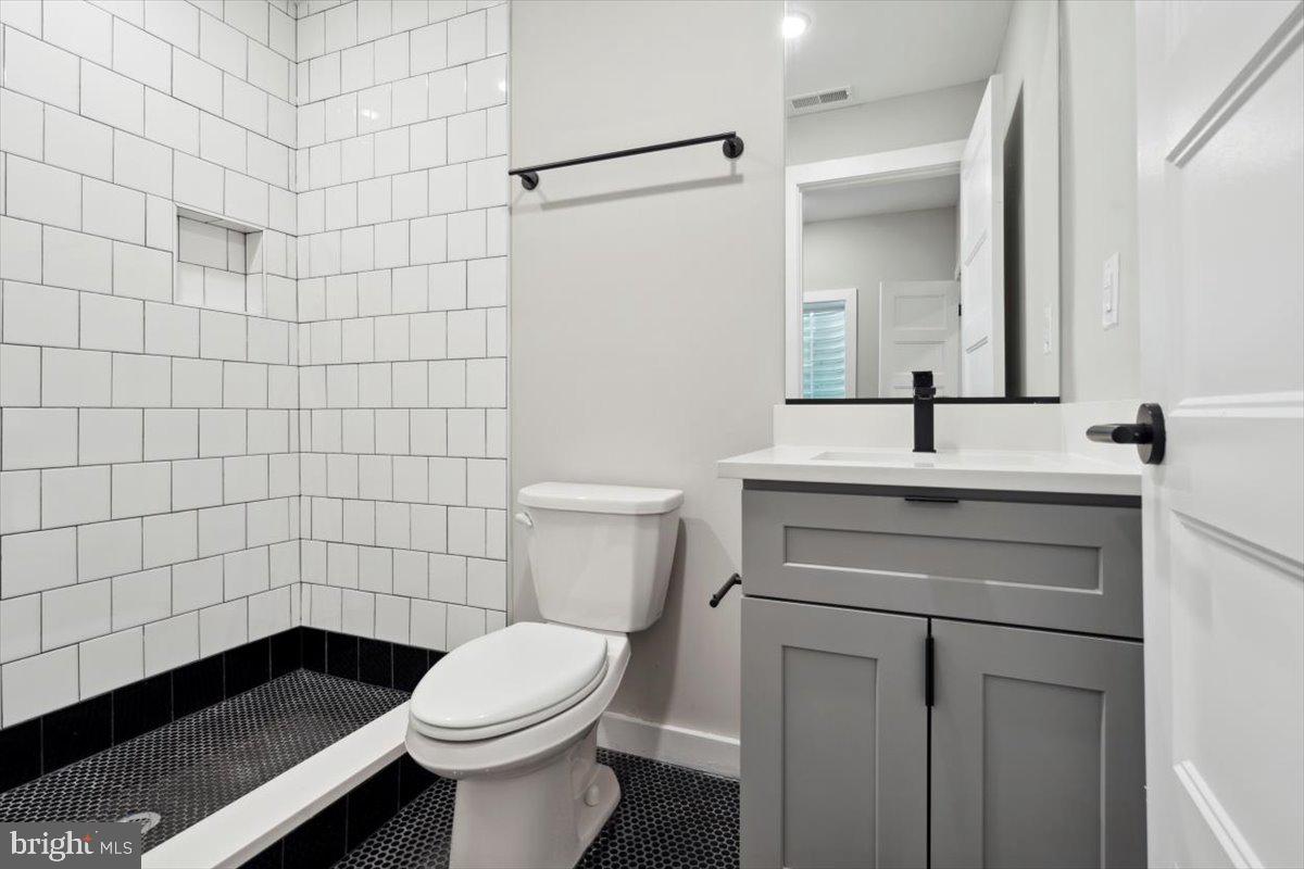 3519 Hamilton Street, Unit A Philadelphia, PA 19104 - Photo 14 of 47 a bathroom with a sink toilet and shower