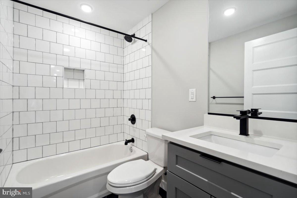 3519 Hamilton Street, Unit A Philadelphia, PA 19104 - Photo 22 of 47 a bathroom with a sink a toilet and shower