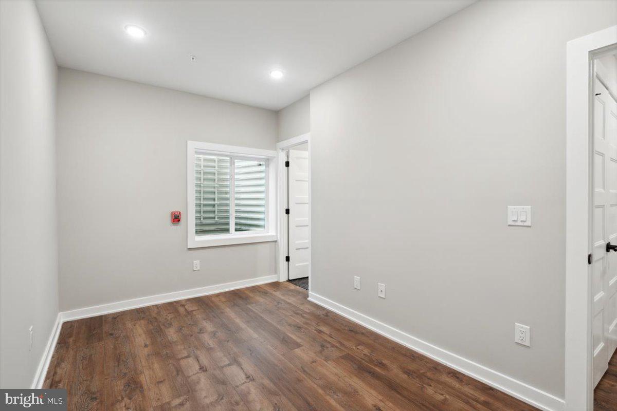 3519 Hamilton Street, Unit A Philadelphia, PA 19104 - Photo 24 of 47 an empty room with wooden floor and windows