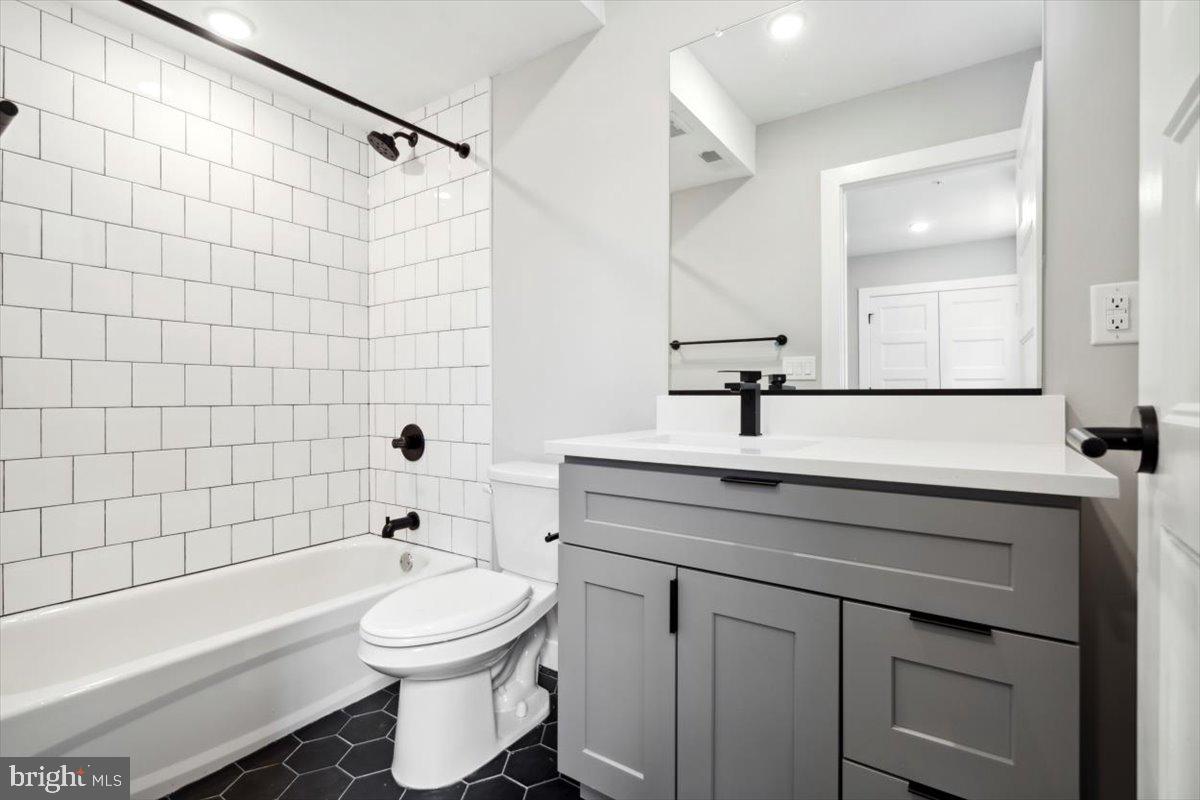3519 Hamilton Street, Unit A Philadelphia, PA 19104 - Photo 34 of 47 a bathroom with a sink a toilet and shower