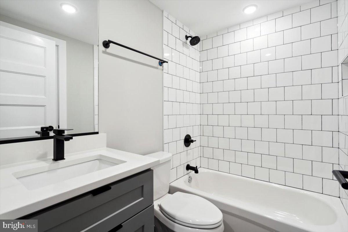 3519 Hamilton Street, Unit A Philadelphia, PA 19104 - Photo 35 of 47 a bathroom with a sink a toilet and shower