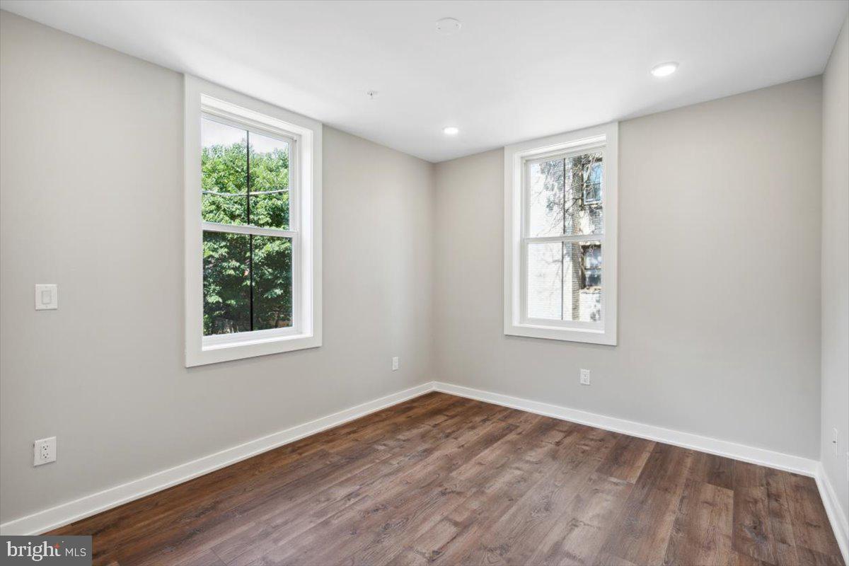 3519 Hamilton Street, Unit A Philadelphia, PA 19104 - Photo 37 of 47 an empty room with wooden floor and windows
