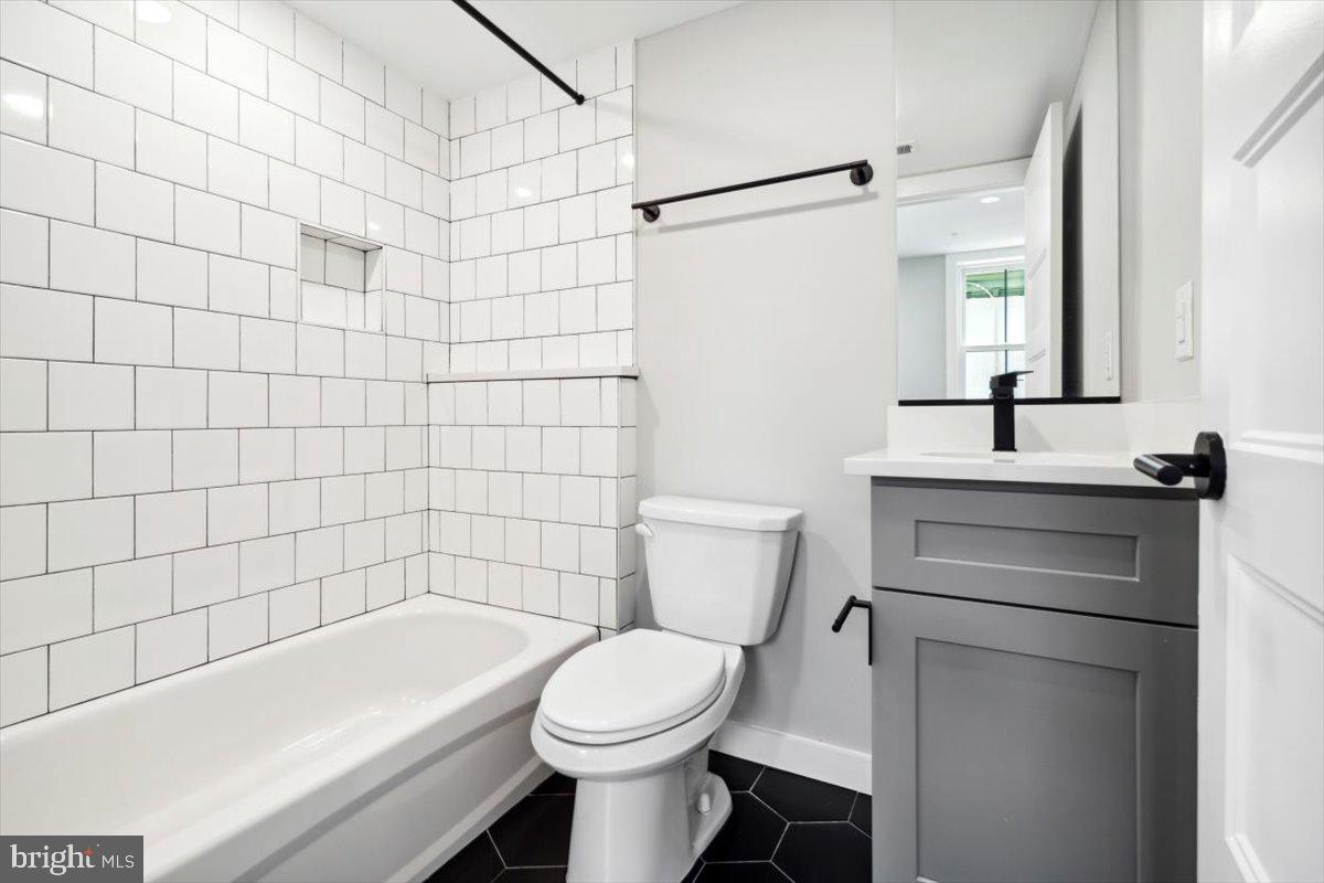 3519 Hamilton Street, Unit A Philadelphia, PA 19104 - Photo 39 of 47 a bathroom with a sink a toilet and shower