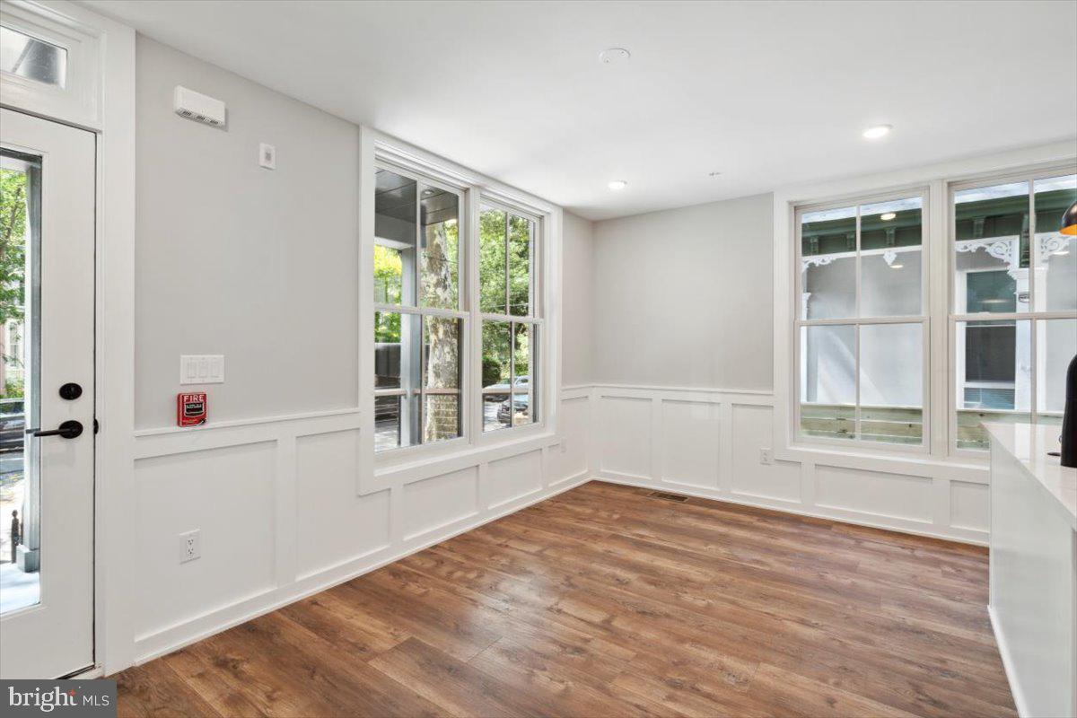 3519 Hamilton Street, Unit A Philadelphia, PA 19104 - Photo 4 of 47 an empty room with wooden floor and windows