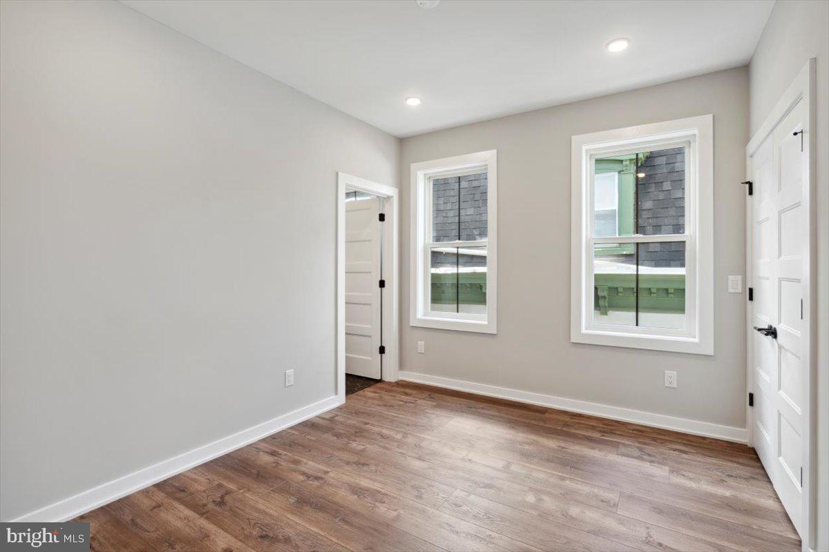 3519 Hamilton Street, Unit A Philadelphia, PA 19104 - Photo 44 of 47 an empty room with wooden floor and windows