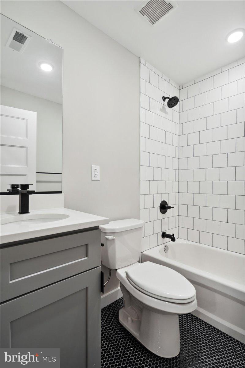 3519 Hamilton Street, Unit A Philadelphia, PA 19104 - Photo 10 of 47 a bathroom with a sink a toilet and a bathtub