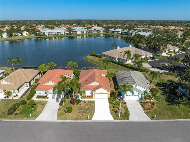 an aerial view of residential houses with outdoor space