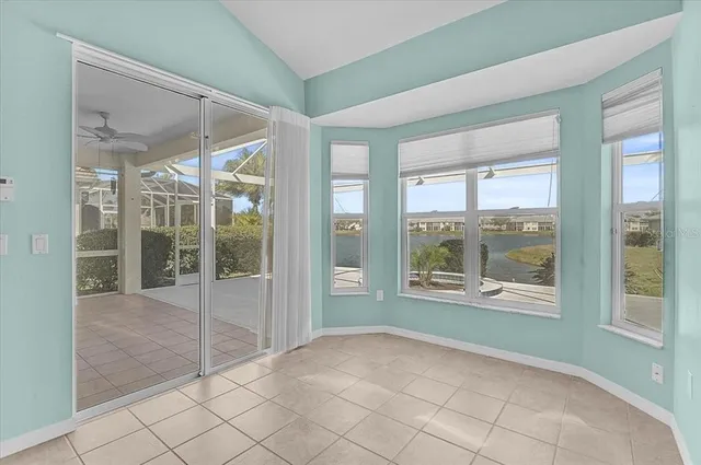 a view of an empty room with glass door