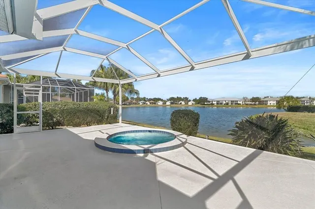 a view of a patio with a table and chairs under an umbrella