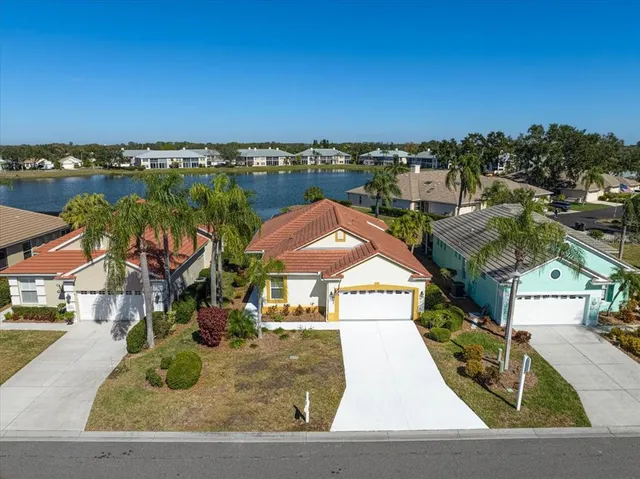 an aerial view of a house with a swimming pool