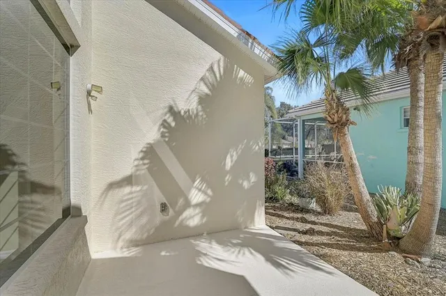 a vase of flowers sitting on a floor