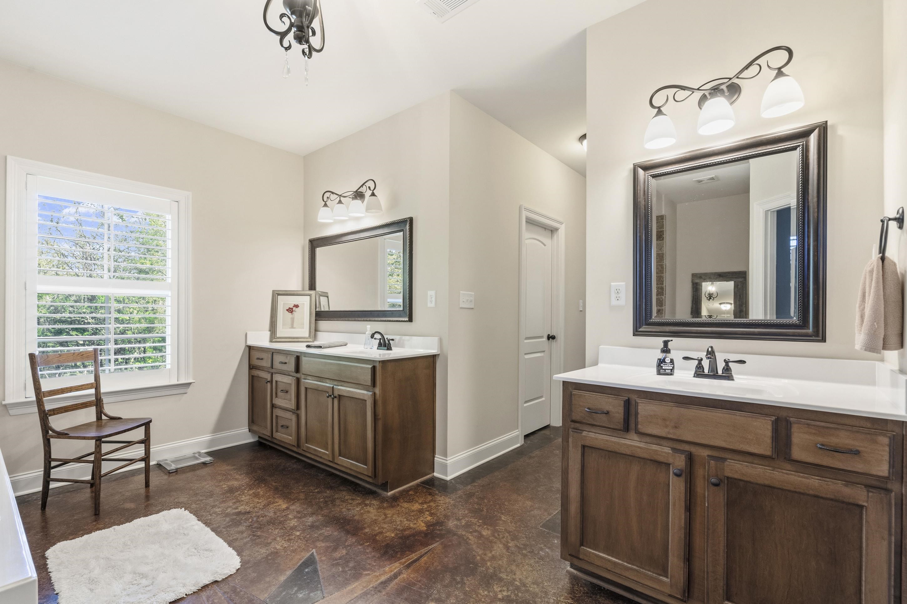 1795 Gaines Road Hernando, MS 38632 - Photo 15 of 40 a bathroom with a sink vanity and mirror