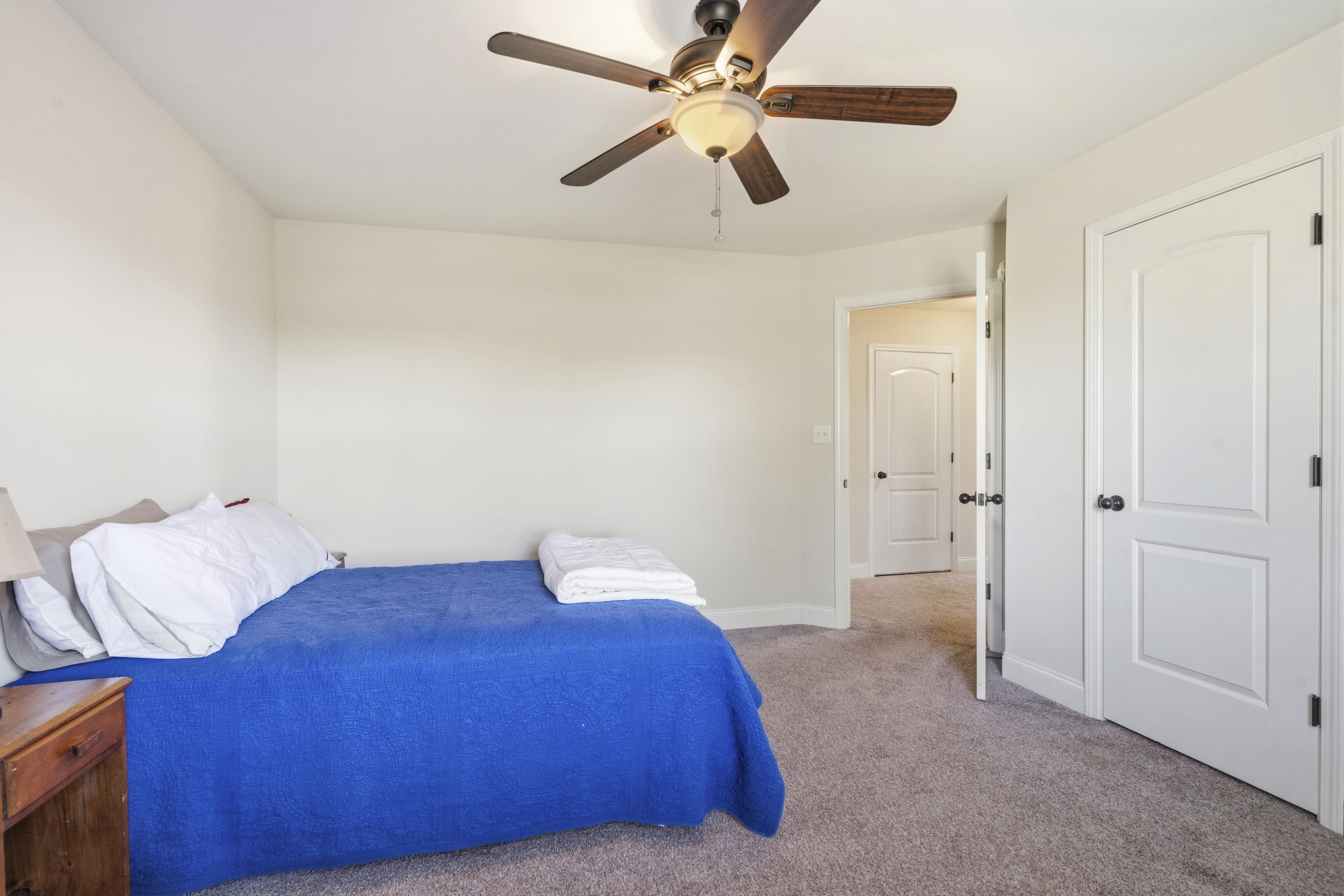 1795 Gaines Road Hernando, MS 38632 - Photo 22 of 40 a bedroom with a bed and a ceiling fan