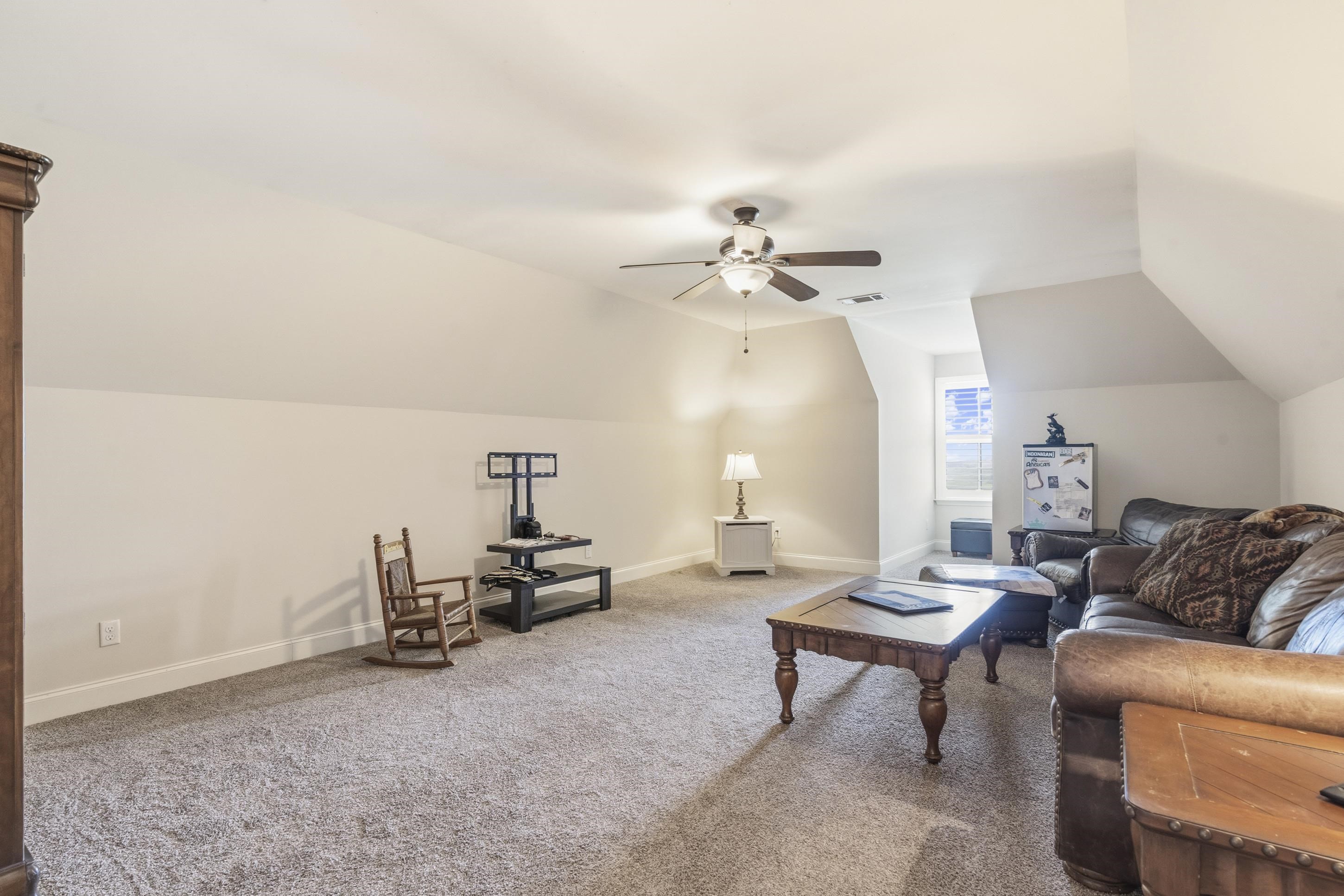 1795 Gaines Road Hernando, MS 38632 - Photo 23 of 40 a living room with furniture and a lamp