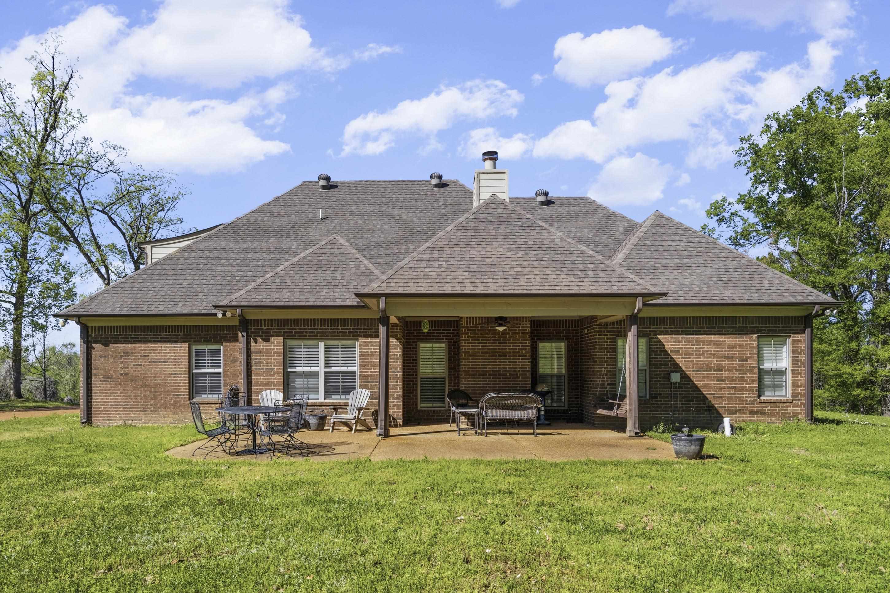 1795 Gaines Road Hernando, MS 38632 - Photo 34 of 40 a view of a house with backyard porch and sitting area